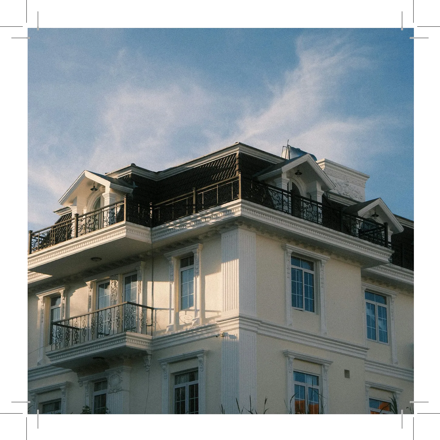 Building corner with balconies and detailed railings